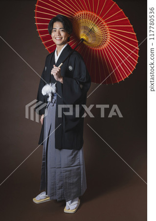 A young man in a hakama with family crest 117780536