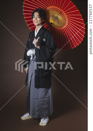 A young man in a hakama with family crest 117780537