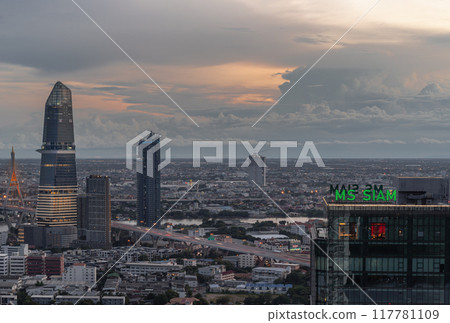Night view of Skyscrapers with KingBridge tower and Supalai Grand Tower alongside the iconic landmark of Bhumibol Bridge. Night view of Skyscrapers with KingBridge tower and Supalai Grand Tower alongside the iconic landmark of Bhumibol Bridge. 117781109