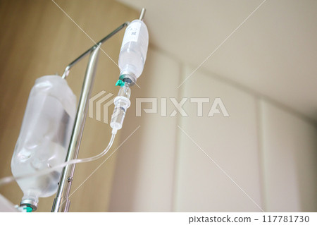 Close up medical intravenous IV drip in hospital background Close up medical intravenous IV drip in hospital background 117781730