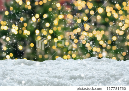 Empty white snow with blur Christmas tree with bokeh light background 117781760