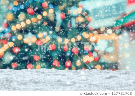 Empty white snow with blur Christmas tree with bokeh light background Empty white snow with blur Christmas tree with bokeh light background 117781768