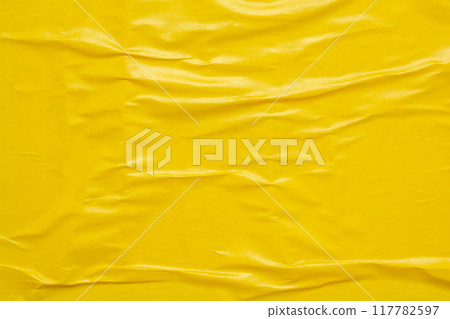 Blank yellow crumpled and creased paper poster texture background 117782597