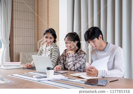 Happy Students Engaged in Study Group Indoors 117785358