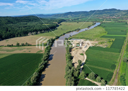 Aerial view of river sand and gravel exploitation, pit, quarry, ballast 117785422