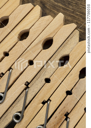 a group of wooden clothespins for drying clothes a group of wooden clothespins for drying clothes 117786038