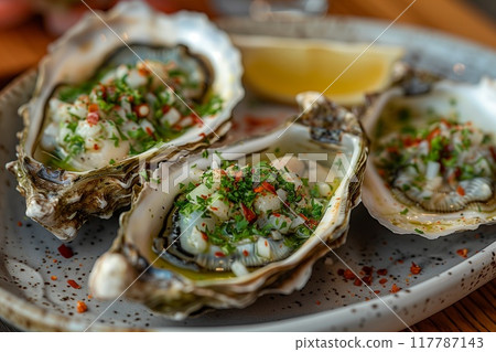 Indulge in Gourmet Oysters, beautifully prepared with Fresh Salsa and delightful Garnishes 117787143