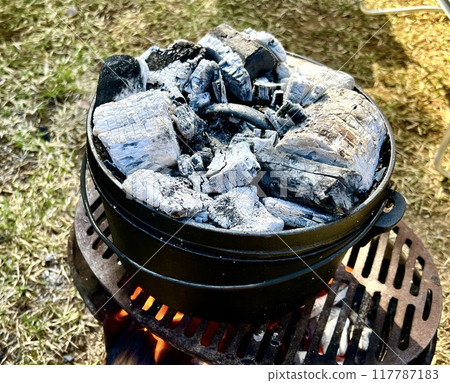 Cooking with a Dutch oven while camping Cooking with a Dutch oven while camping 117787183