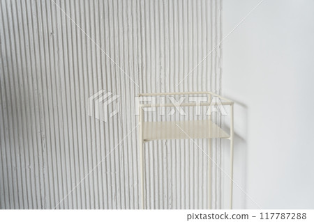 A white metal table on a white background, a layout for your product, a space for your design, a podium, a painted metal table with a place to copy. High quality photo 117787288