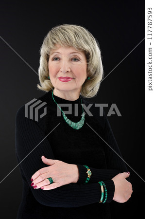 Ageless Beauty: 76-Year-Old Model Stuns in Malachite Jewelry and Black Turtleneck | Redefining Senior Fashion Photography. 117787593