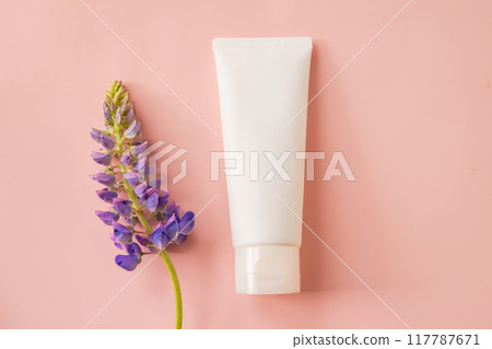 cosmetic moisturizer cream bottle tube and lupine flower on pink background. Shampoo, skincare, facial cream, gel, sunblock or sunscreen. white blank tube, template mockup cosmetic moisturizer cream bottle tube and lupine flower on pink background. Shampoo, skincare, facial cream, gel, sunblock or sunscreen. white blank tube, template mockup 117787671