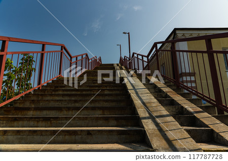 Steps up, pedestrian crossing over railway tracks Steps up, pedestrian crossing over railway tracks 117787728