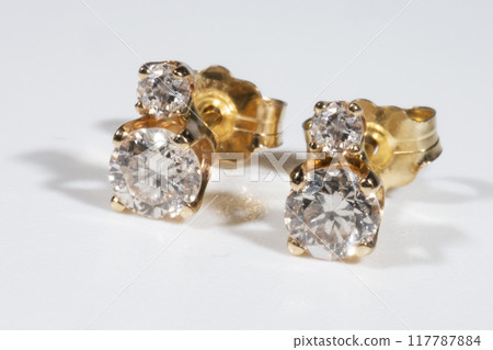 Diamond Earrings Isolated on White Background. Yellow Gold Diamond Earring Pair with 750 Stamp Denoting 18-Carat Yellow Gold. 117787884
