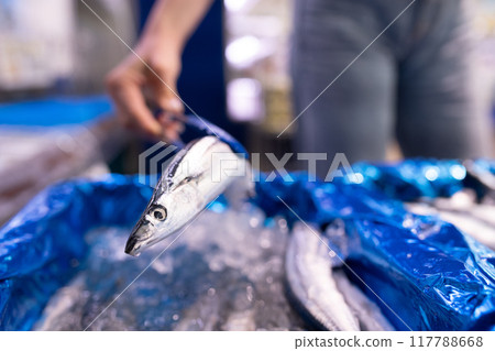 Shoppers choosing pacific saury 117788668