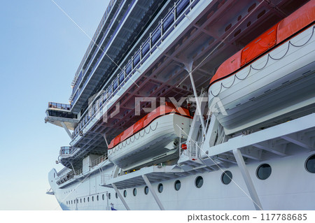 Large modern luxury cruise ship side view with lifeboats Large modern luxury cruise ship side view with lifeboats 117788685