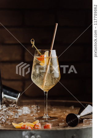 Elegant cocktail with citrus garnish in a wine glass, perfect for upscale dining and bar promotions Elegant cocktail with citrus garnish in a wine glass, perfect for upscale dining and bar promotions 117789862