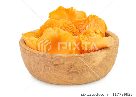 Chanterelle mushrooms in a wooden bowl isolated on a white background Chanterelle mushrooms in a wooden bowl isolated on a white background 117789925