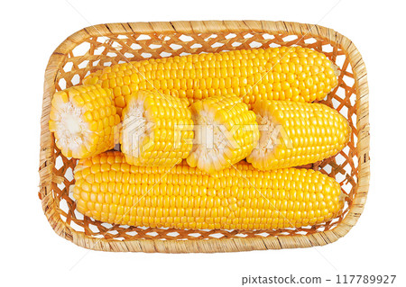 ear of corn in a wicker basket isolated on a white background. Top view. Flat lay ear of corn in a wicker basket isolated on a white background. Top view. Flat lay 117789927