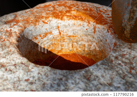 Close-up of handmade mortar for paprika production. Close-up of handmade mortar for paprika production. 117790216