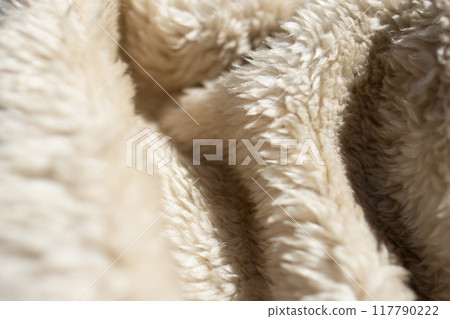Fur blanket in wavy shapes. Soft background with texture 117790222