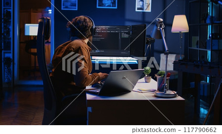 Hyperactive software developer suffering from adhd affliction, writing code, drinking coffee, listening music, arranging desk objects. Distracted IT admin doing multitasking in home office, camera B 117790662