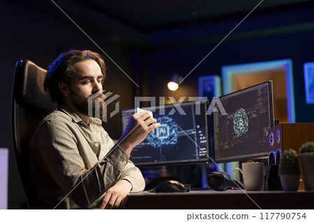 Hacker uploading evolved sentient AI to disk, planning to use it for evil mastermind plan. Rogue programmer putting malware infected artificial intelligence bot in cartridge 117790754