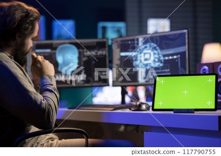 Isolated screen tablet next to sentient AI interacting with computer engineer, asking questions after modifying own source code. Chroma key device on desk next to self aware artificial intelligence 117790755
