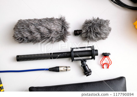A shotgun microphone set, a professional-grade microphone for recording sound in filmmaking and interviews A shotgun microphone set, a professional-grade microphone for recording sound in filmmaking and interviews 117790894
