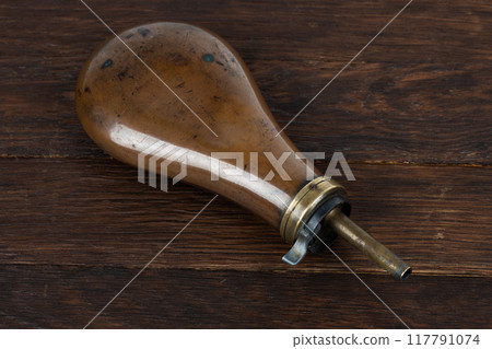 Old west gunpowder flask 117791074