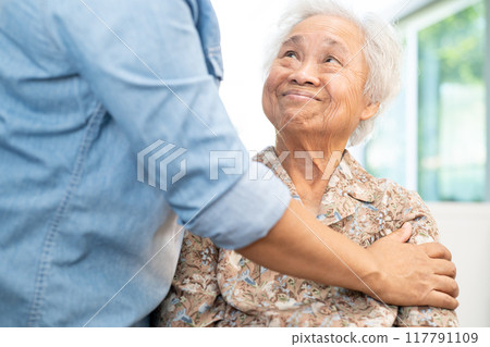 Caregiver help and care Asian senior woman patient with love, encourage and empathy in hospital. Caregiver help and care Asian senior woman patient with love, encourage and empathy in hospital. 117791109