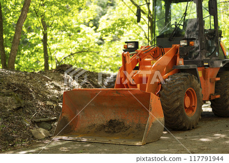 Wheel loader working on a forest road Wheel loader working on a forest road 117791944