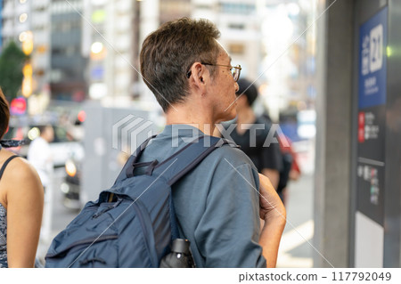 Senior man walking in the city 117792049