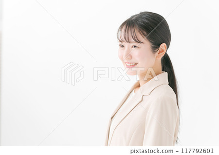 Young woman in a suit Young woman in a suit 117792601
