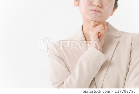 A woman in a suit with a thinking expression 117792755
