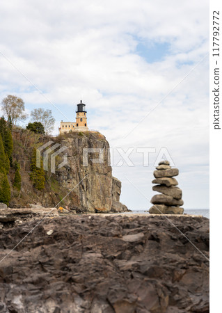 A beautiful view of Split Rock Lighthouse on the rocky coast of Lake Superior. 117792772