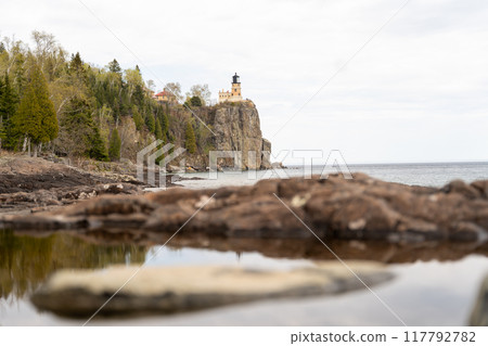 A beautiful view of Split Rock Lighthouse on the rocky coast of Lake Superior. 117792782