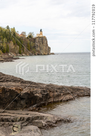 A beautiful view of Split Rock Lighthouse on the rocky coast of Lake Superior. 117792819