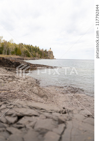 A beautiful view of Split Rock Lighthouse on the rocky coast of Lake Superior. 117792844