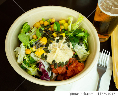 Salad with hummus, salmon 117794047