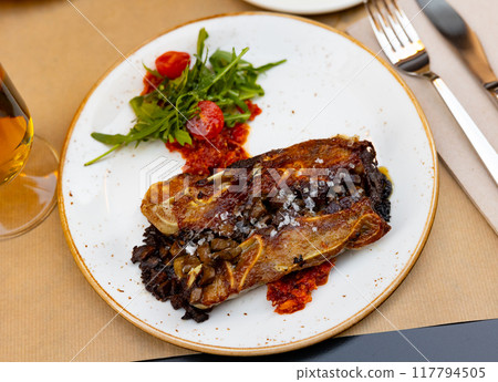 Appetizing meat dish Terrine of pork ears and kidneys with red pesto sauce 117794505