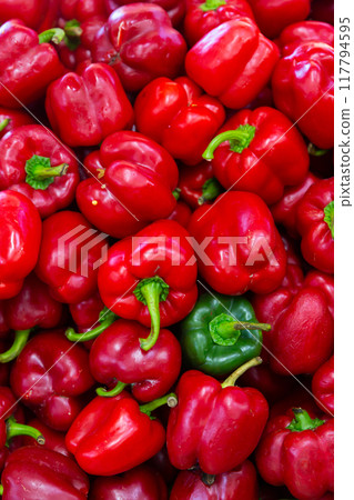 Closeup of ripe red bell peppers 117794595