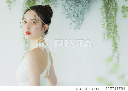 Young woman in wedding dress Young woman in wedding dress 117795764