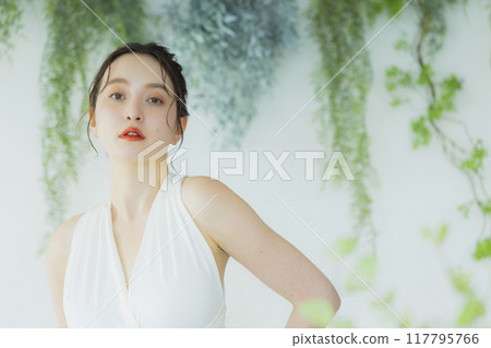 Young woman in wedding dress Young woman in wedding dress 117795766