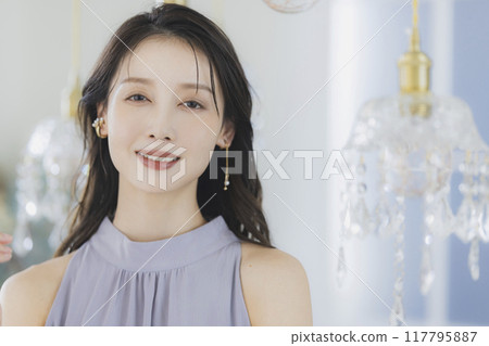 Young woman by the window 117795887