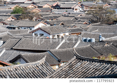Rooftop of residence in Lijiang old town. It is a well-preserved Naxi ancient town, listed as UNESCO World Heritage site in 1997. Rooftop of residence in Lijiang old town. It is a well-preserved Naxi ancient town, listed as UNESCO World Heritage site in 1997. 117795923
