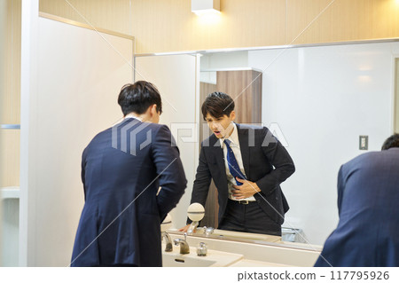 A man suffering from abdominal pain A man suffering from abdominal pain 117795926