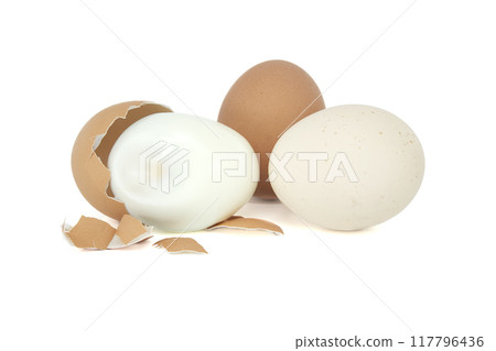 Egg in the process of being peeled, isolated on white 117796436
