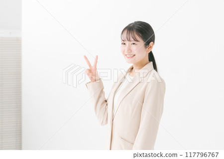 A woman making a peace pose 117796767