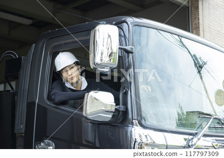 Workers working on a truck 117797309