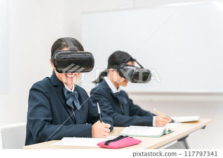 Junior high school and high school girls studying with VR goggles (VR AR MR) Junior high school and high school girls studying with VR goggles (VR AR MR) 117797341
